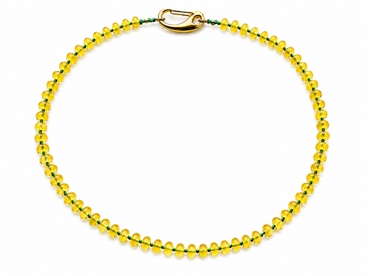 collar arun amarillo y cordón verde encerado.